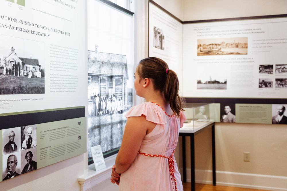 A young girl viewing exhibits at Virginia Randolph Museum