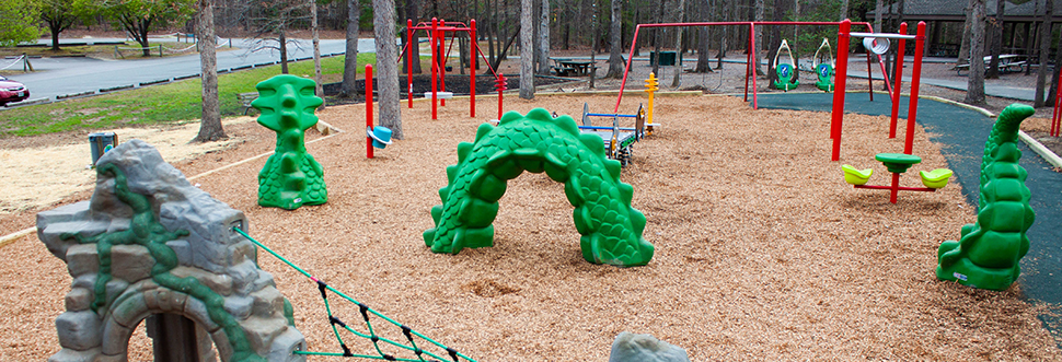 A view of much of the play equipment in the large playground at Deep Run Park.