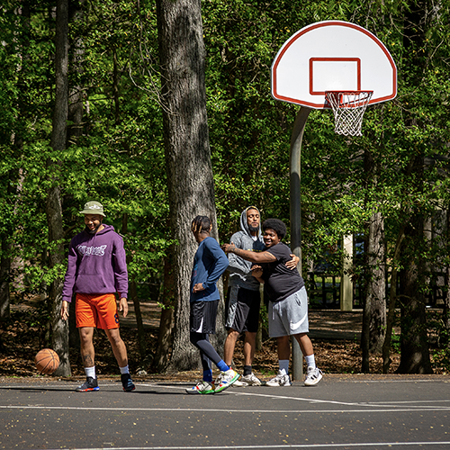Group playing basketball