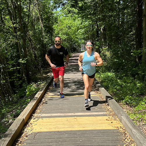photo of runners on a trail